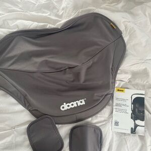 Doona seat canopy and shoulder pads